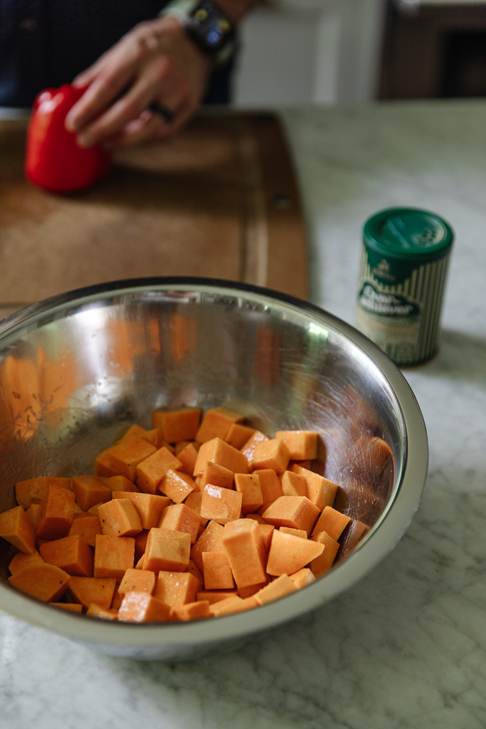 Sweet potatoes chopped in a stainless steel bowl
