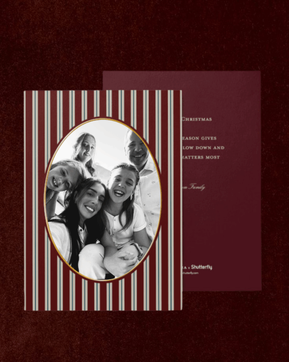 Family holiday photo framed in a Christmas card, featuring a smiling group celebrating Christmas together, festive striped background, perfect for Christmas greeting cards and family holiday photography in the USA.