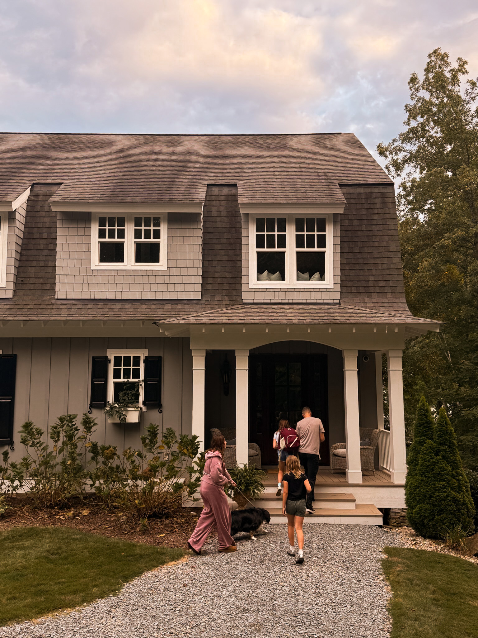 The Marcum family walking into the Merrimore lake house