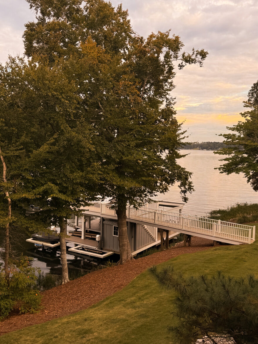 Merrimore lake house original back dock with boat at sunset