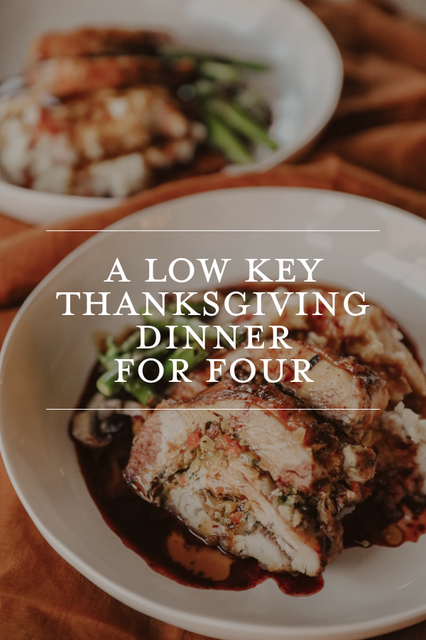 Turkey with stuffing, cranberry sauce, and gravy on a white plate, perfect for Thanksgiving dinner.