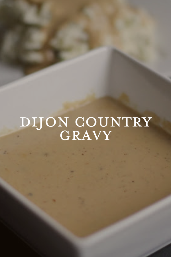 Dijon country gravy in a white serving dish, focusing on homemade comfort food recipes and Southern cooking.