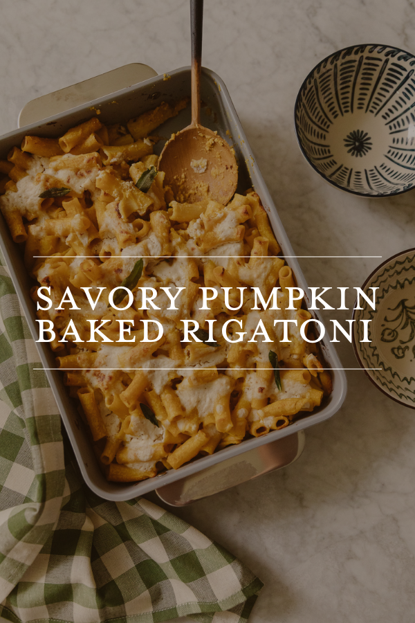 Homemade savory pumpkin baked rigatoni in a baking dish, topped with cheese, ready to serve, perfect for fall recipes.