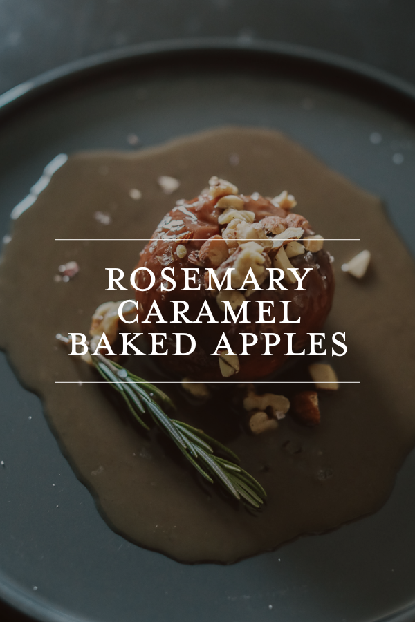 A beautifully plated rosemary caramel baked apples on a dark plate, garnished with fresh rosemary and chopped nuts, perfect for fall desserts and cozy autumn gatherings.