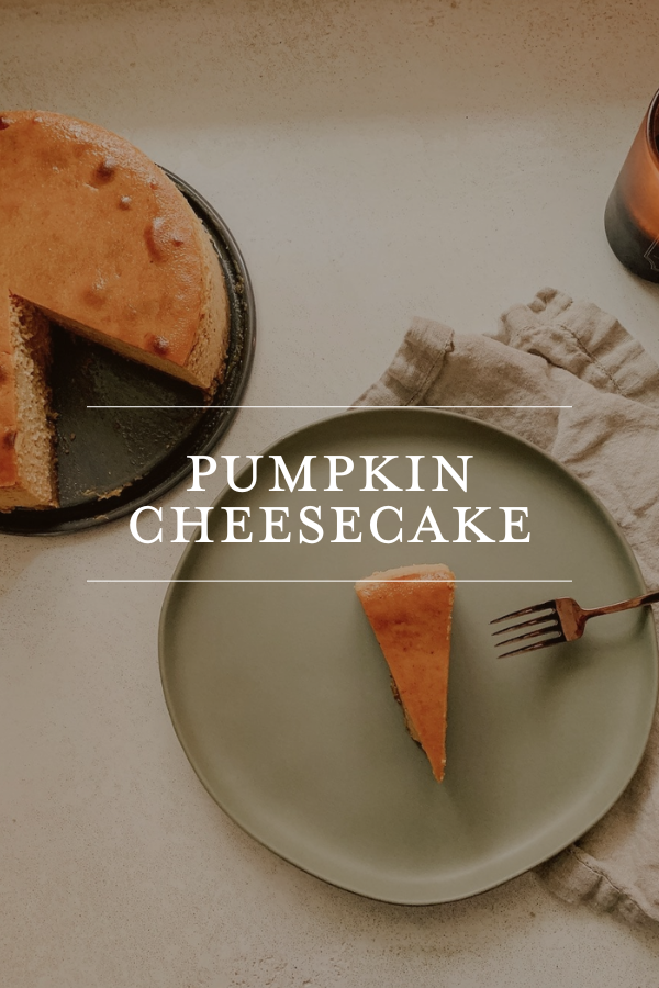 Pumpkin cheesecake on a gray plate with a slice served on a fork; fall dessert, homemade pumpkin cheesecake recipe, seasonal baking, dessert photography, Chris Loves Julia.