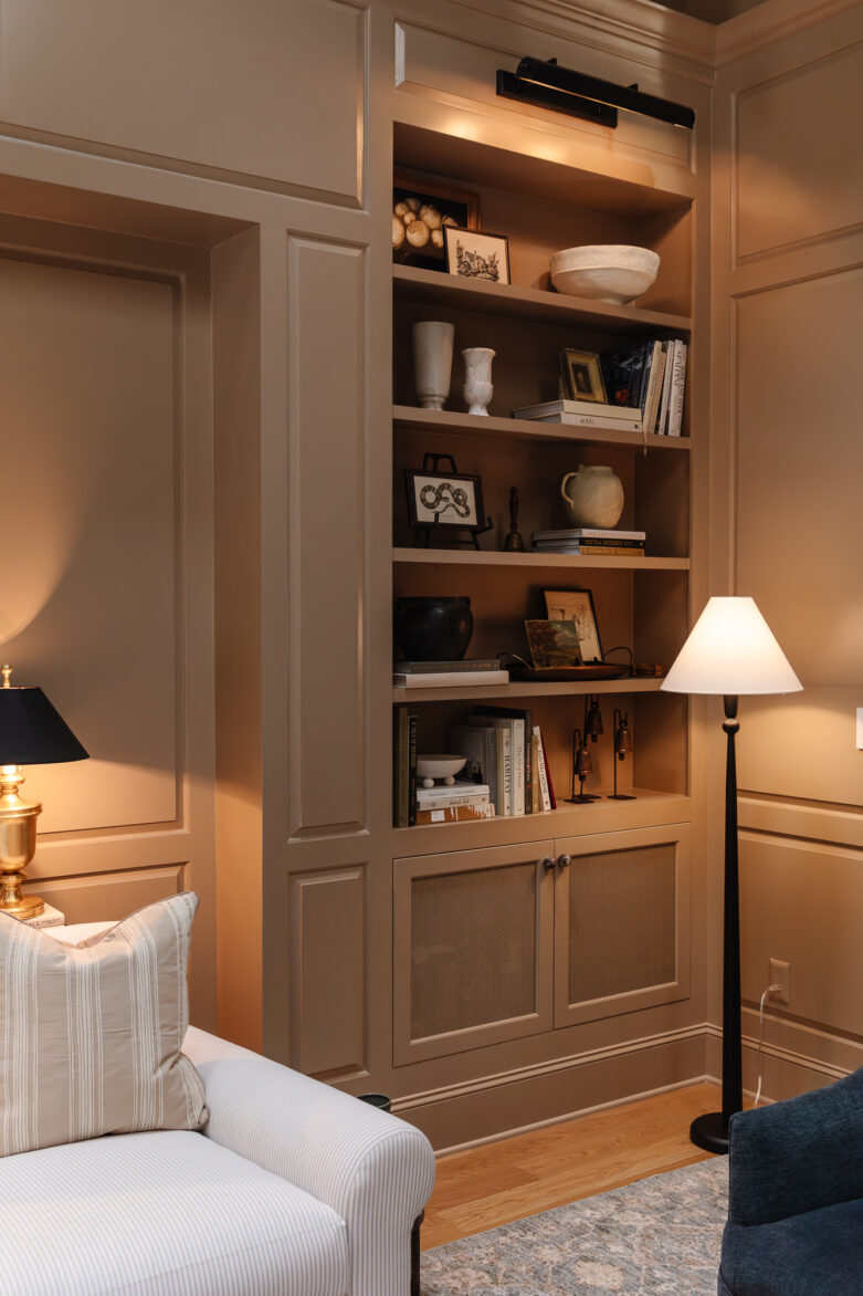 Elegant built-in bookshelf with decorative accents in a cozy living room.