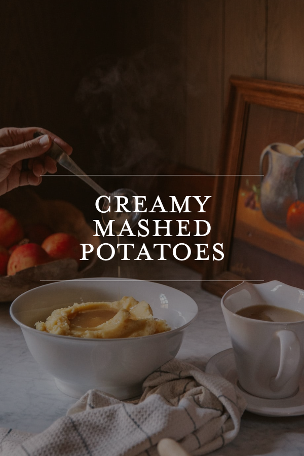Creamy mashed potatoes served in a white bowl with steam rising, showcasing a comforting homemade side dish perfect for holidays and family dinners.