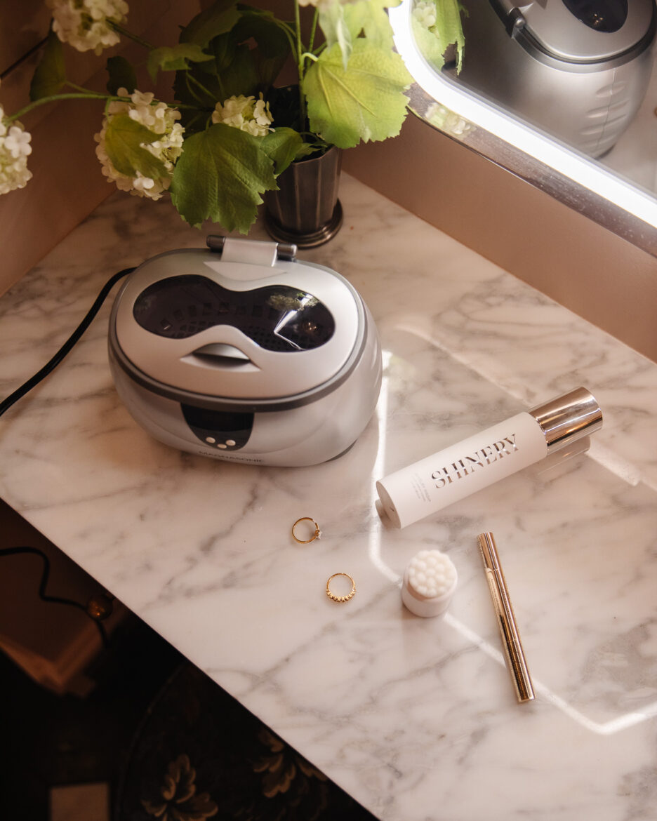 Marble countertop in the bathroom with various jewelry cleaners