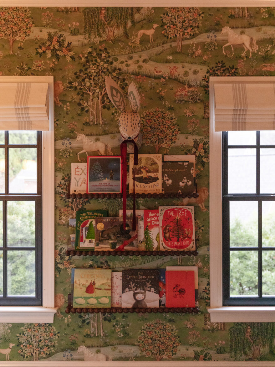 Whimsical Christmas books on bookshelves in kid's room