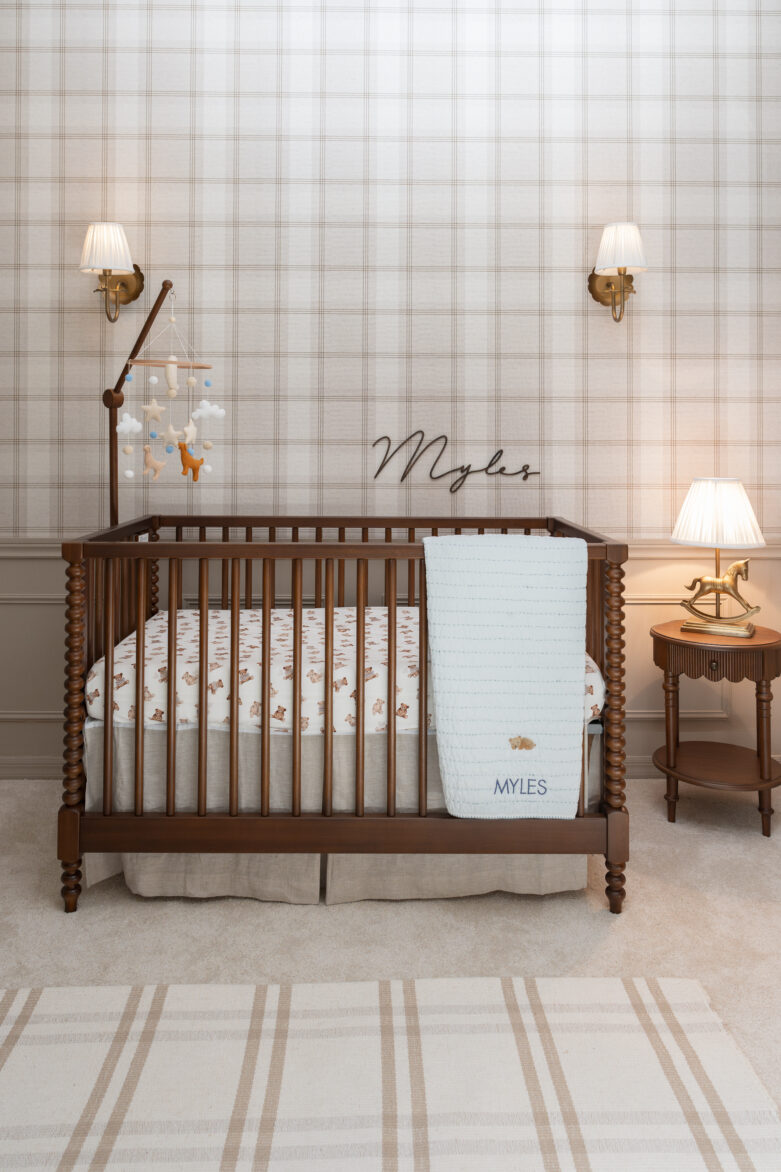 Decorative gallery wall with gold frames, personalized artwork, and family photos, perfect for enhancing living room aesthetics and creating a warm, personalized home atmosphere.