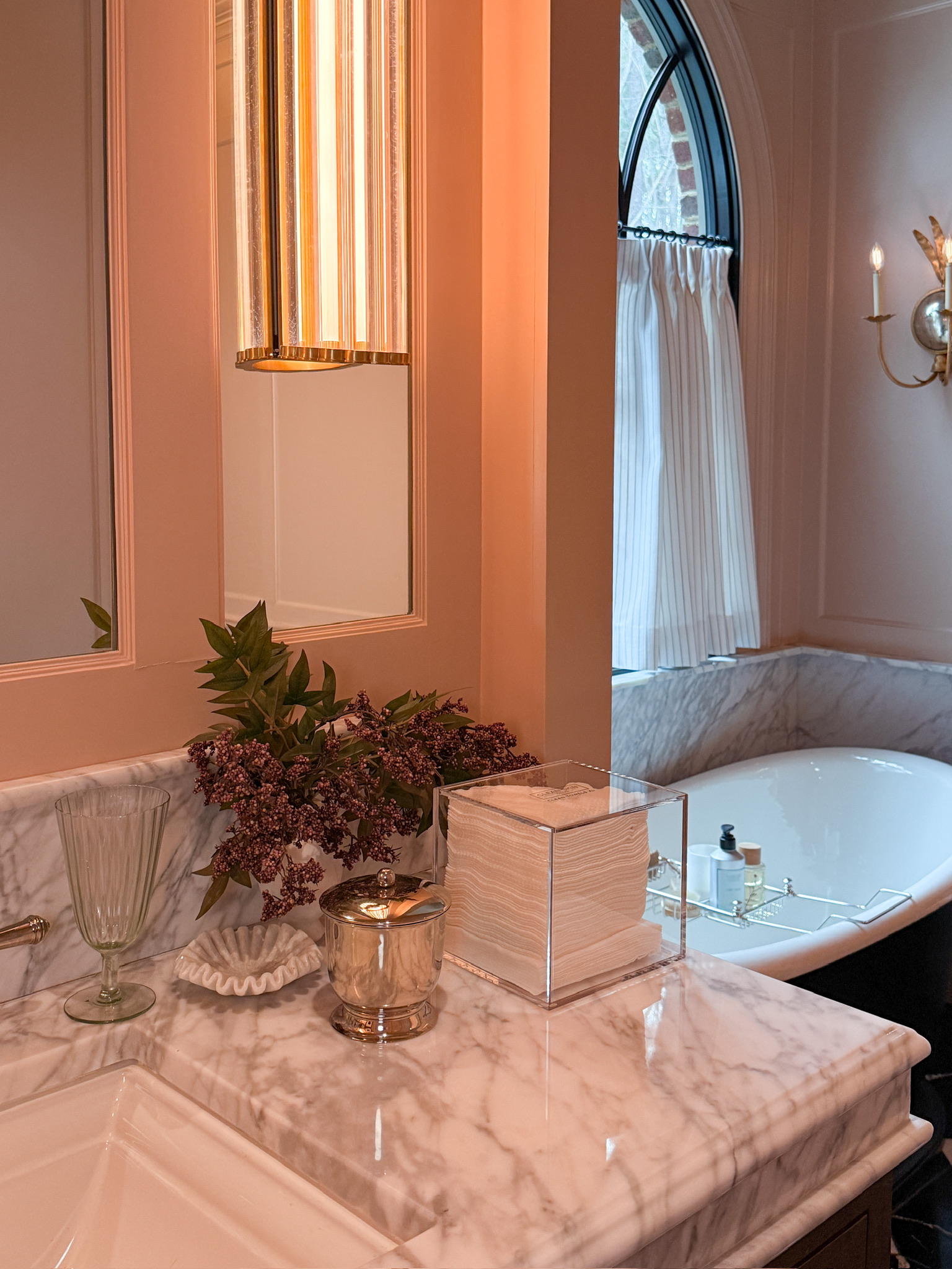 Face towels in a acrylic holder on a bathroom vanity