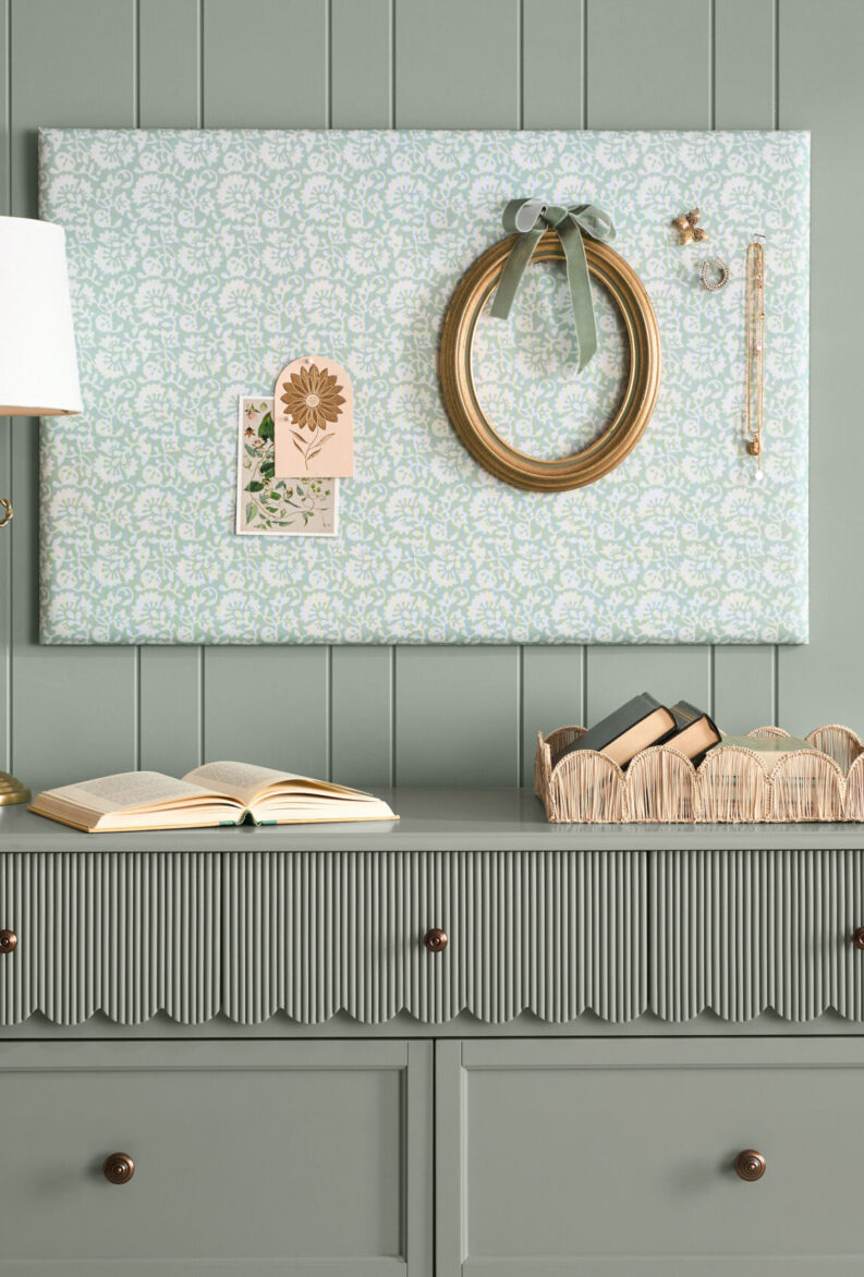Elegant wall organizer with decorative wreath and accessories.
